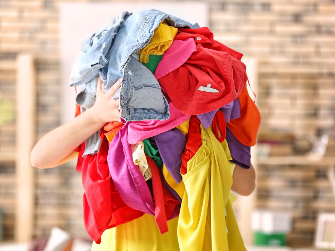 person carrying laundry