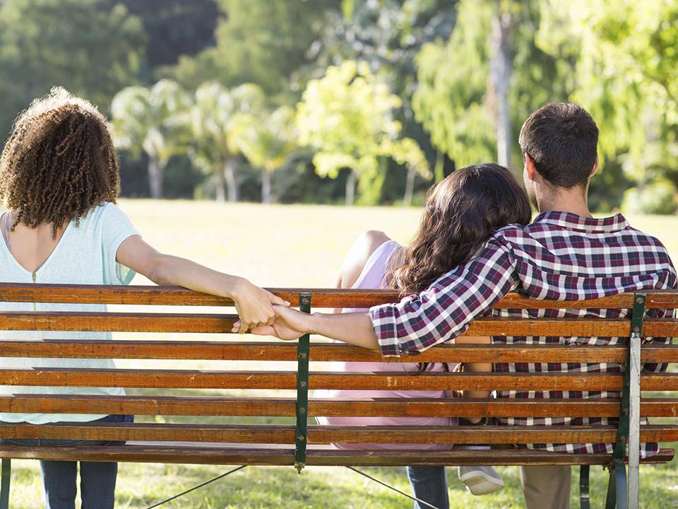 Man being unfaithful in park