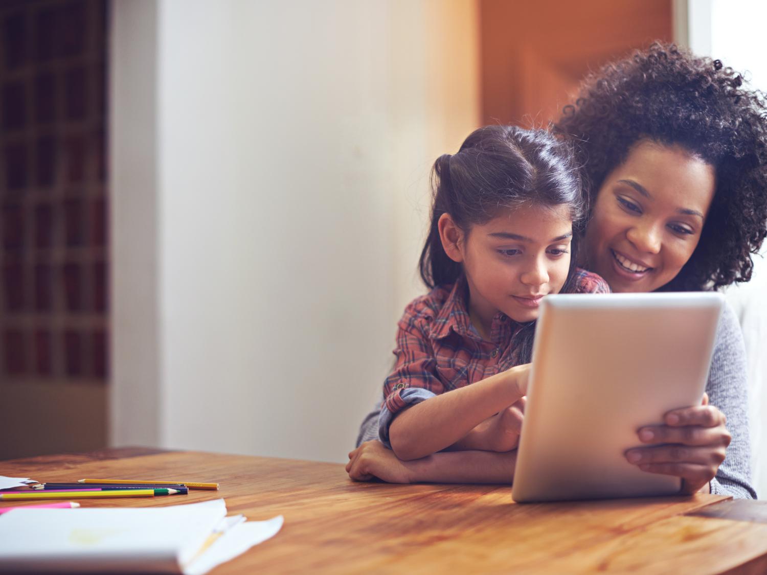 Woman and child using tablet
