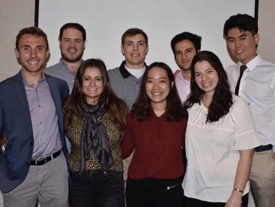 The 2018-2019 officers stand in two lines and smile.