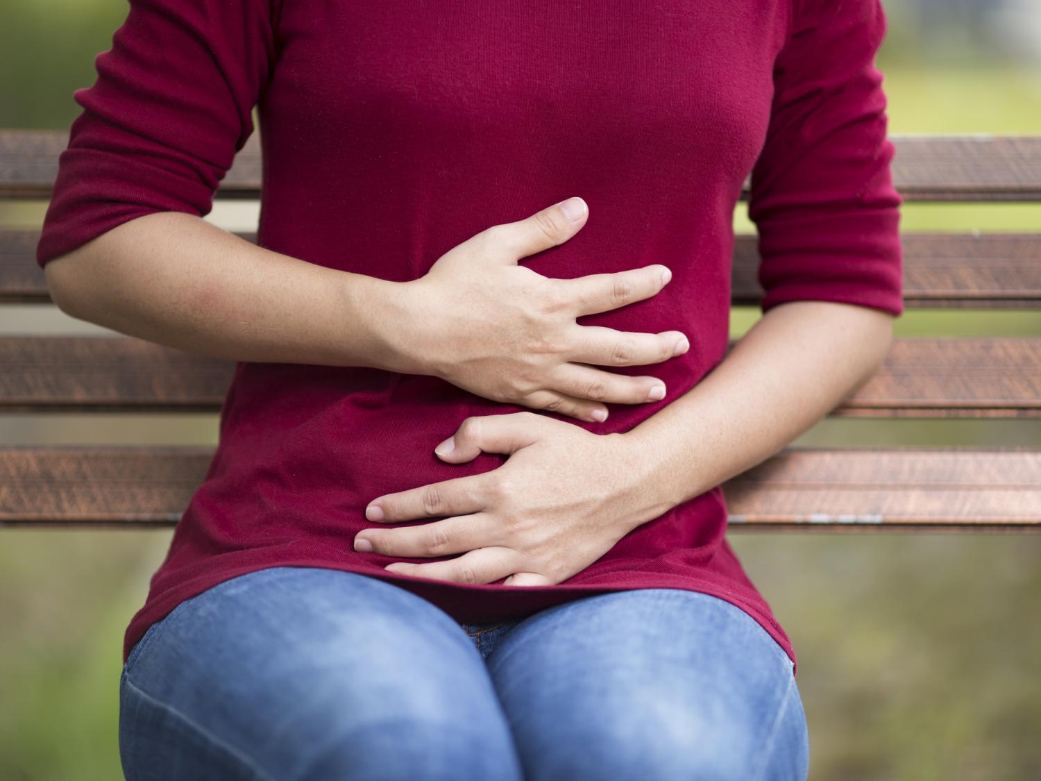woman holding stomach