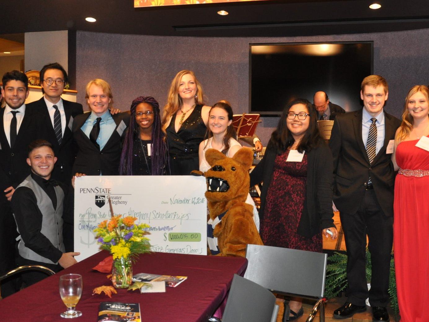 students with big check