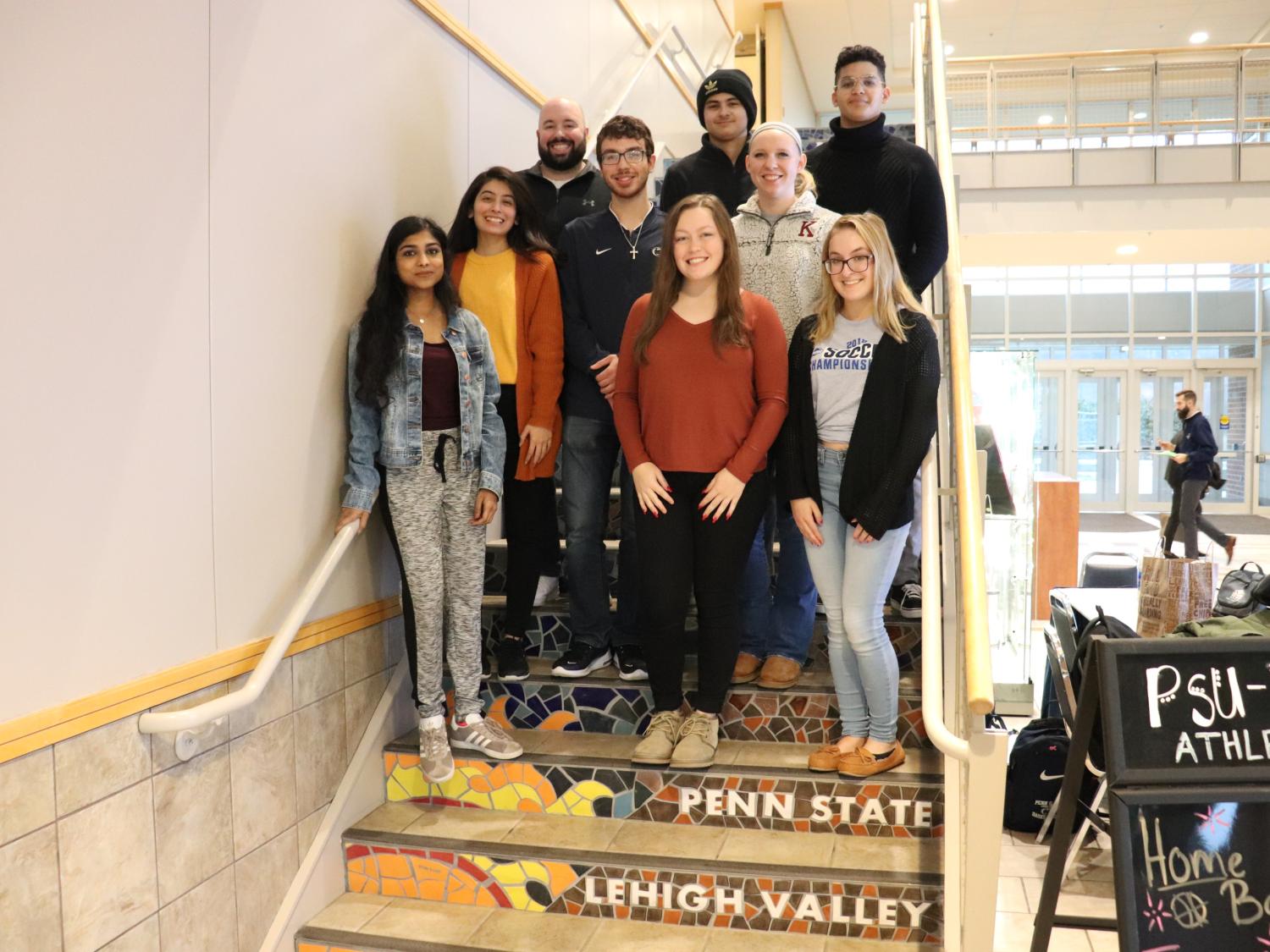 group of students and staff on steps