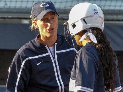 Penn State softball coach Amanda Lehotak speaks to a Nittany Lion softball player during fall practice.