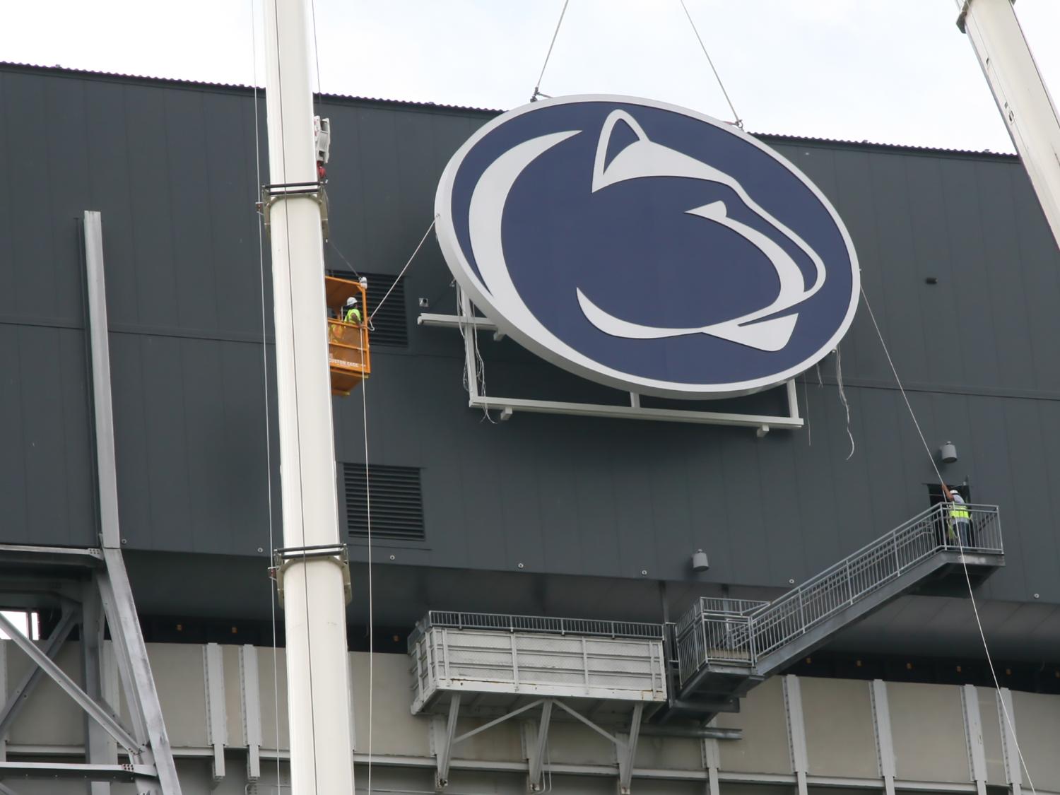 Lion logo hoisted to scoreboard 3 of 3