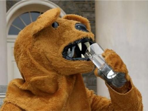 Nittany Lion drinks a glass of water