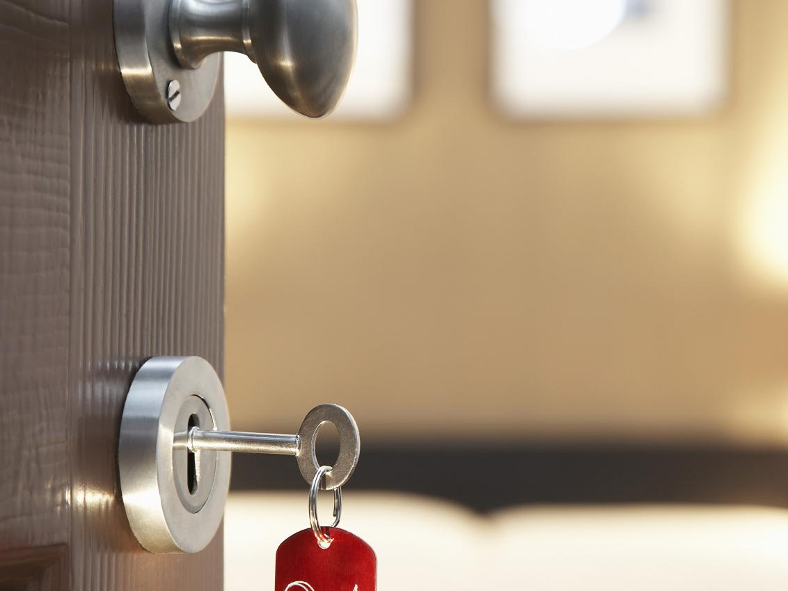 hotel room key in door
