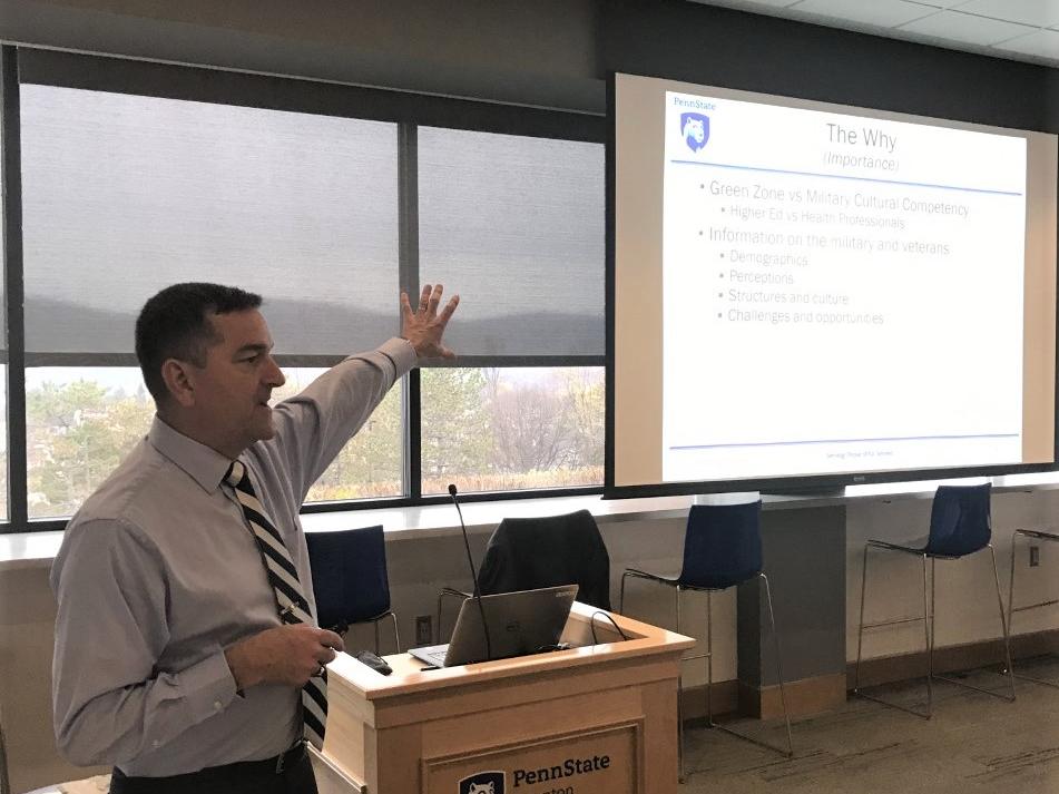 McFeeley at podium speaking to attendees