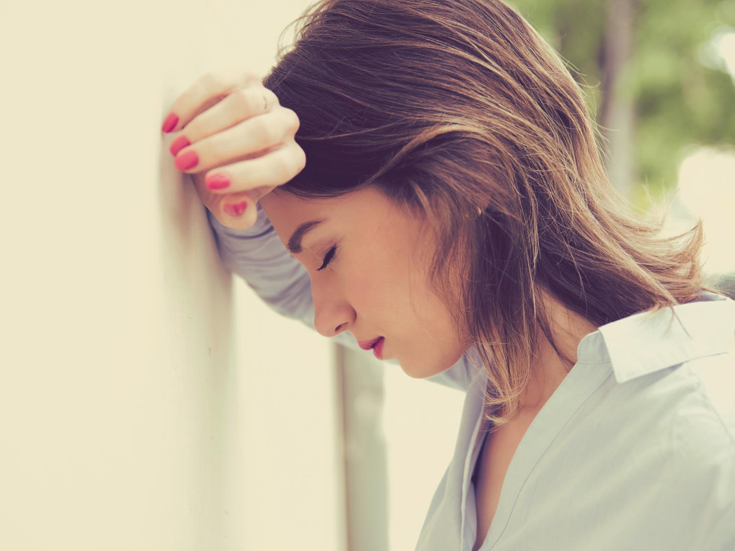 woman head against wall