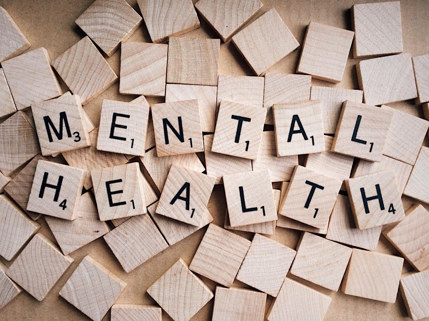 Letter tiles spelling "mental health"