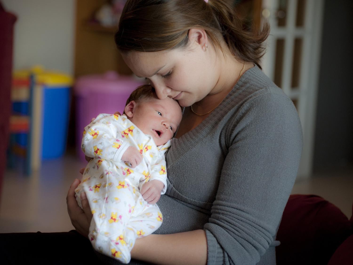 a mom holding a baby