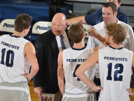 Coach Mark Pavlik talks to Penn State men's volleyball players during a break in action