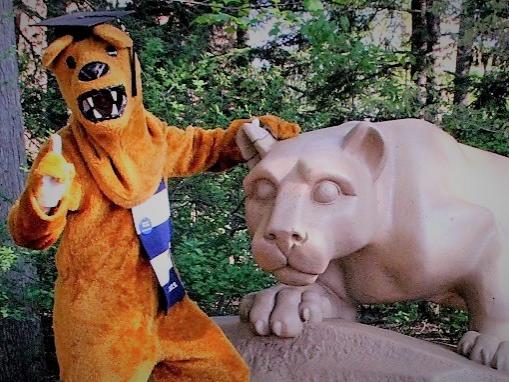 nittany lion mascot wearing graduation cap posing for a photo at Nittany Lion Shrine