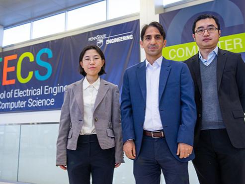 three faculty members pose for a picture
