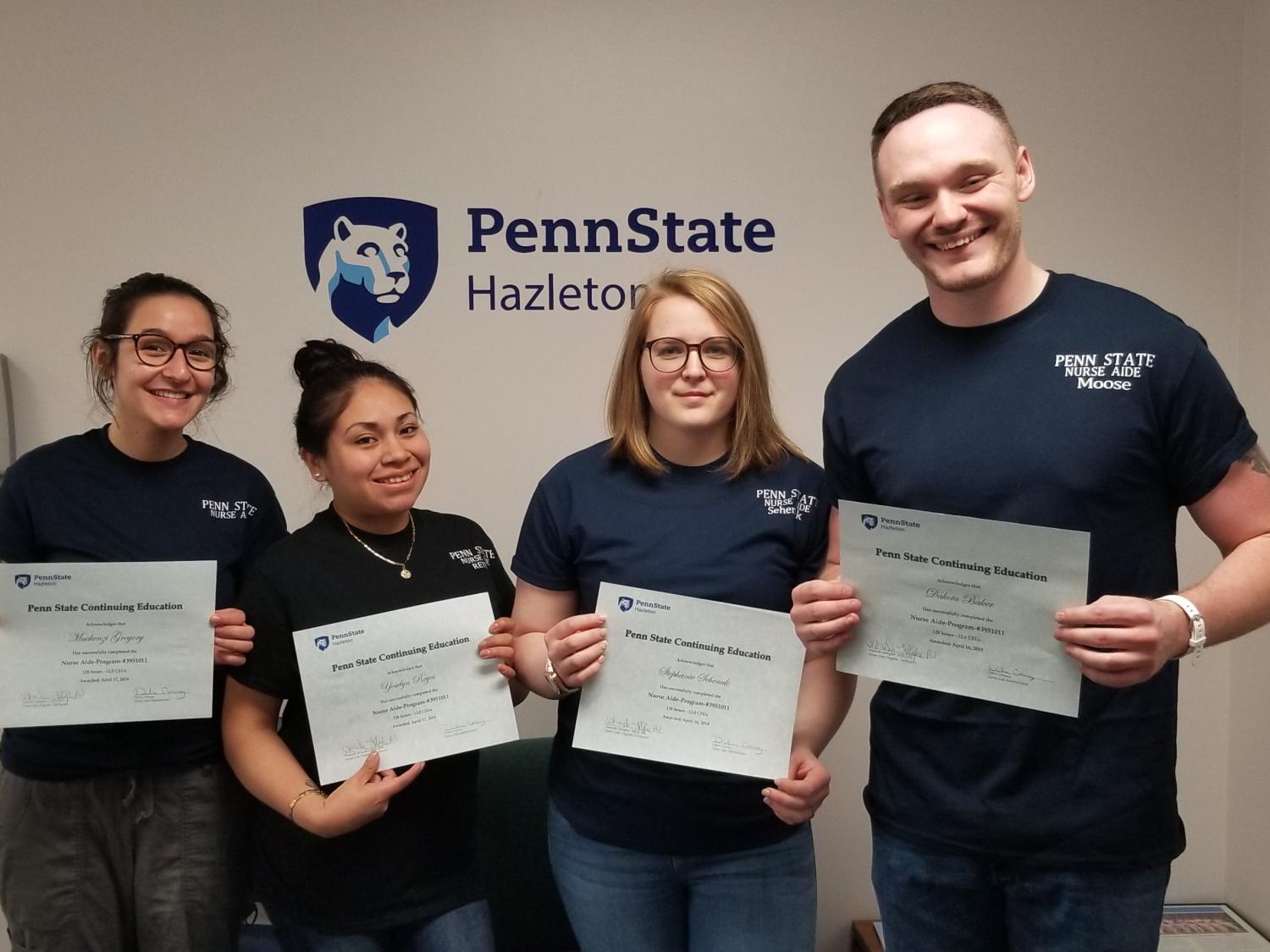 Nurse aide graduates are, from left: Mackenzi Gregory, Yoselyn Reyes, Stephanie Sehenuk and aide Dakota Baker.