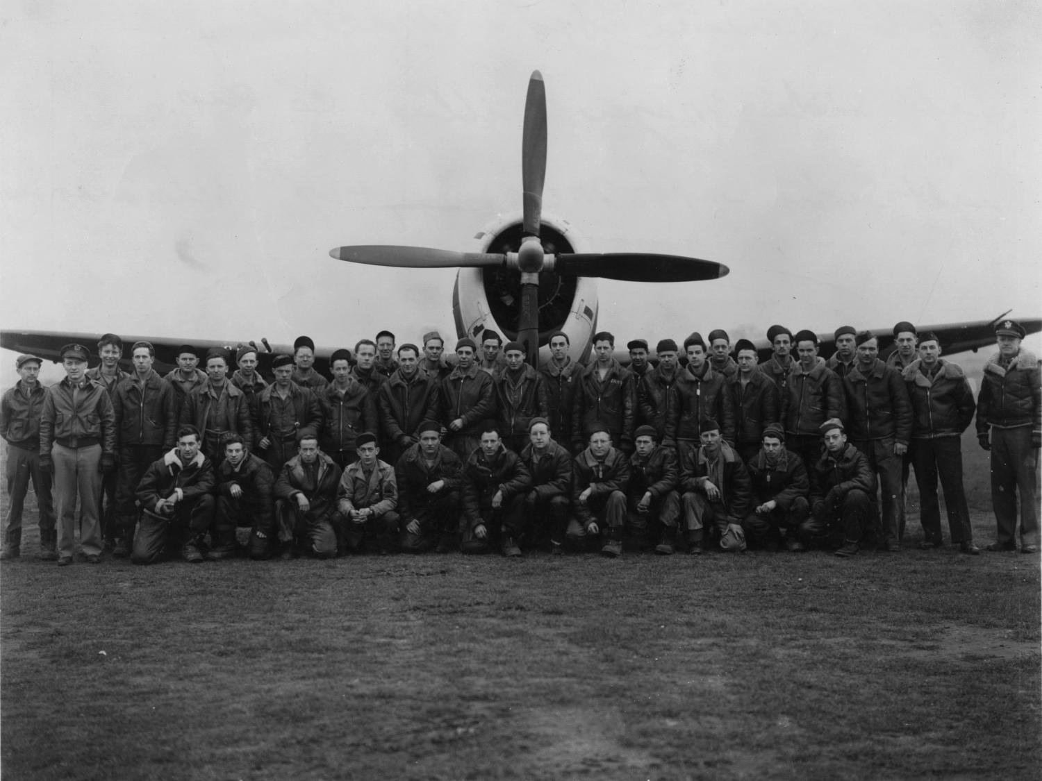 WW II air force personnel in front of a plane