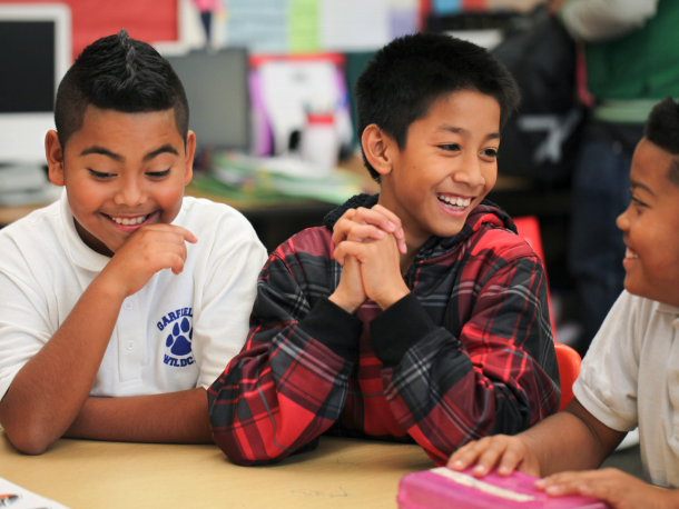 3 boys in a middle school classroom
