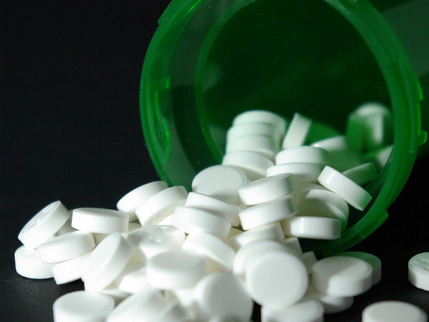 white pills in green container