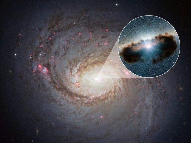 Hubble image of Galaxy NGC 1068, with illustration of active black hole at its core