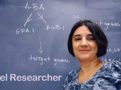 woman in front of chalk board