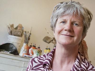 Helen O’Leary smiling in her art studio