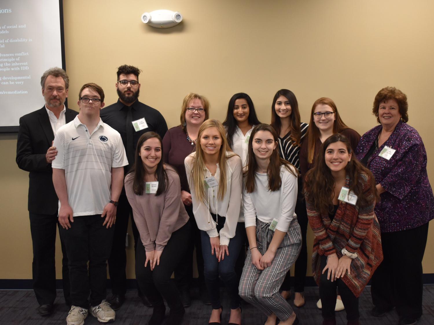 group of students, guest speaker and faculty