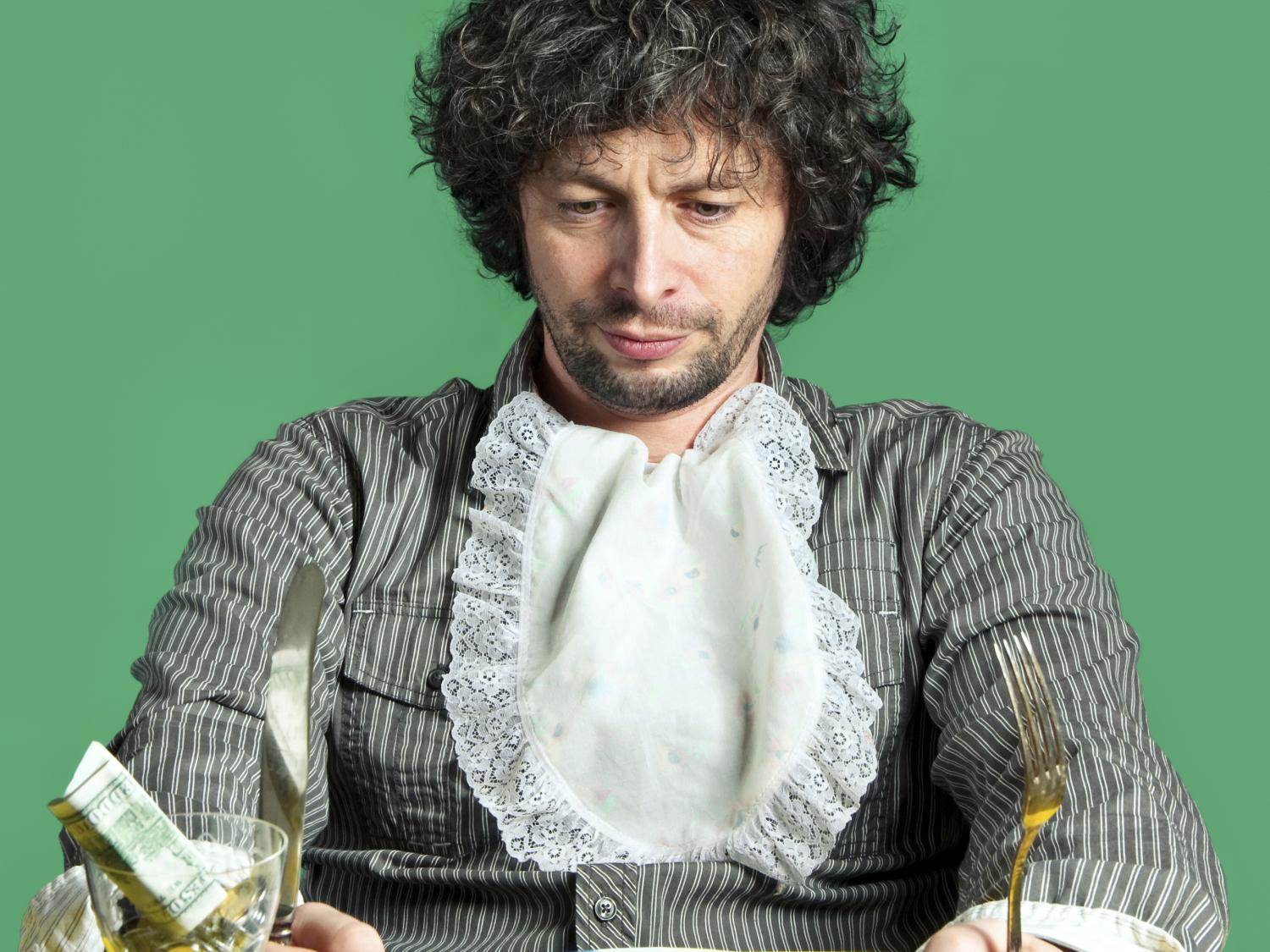 man with money on plate