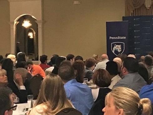 The scholarship reception attendees listening to Dr. Marwan Wafa's welcome