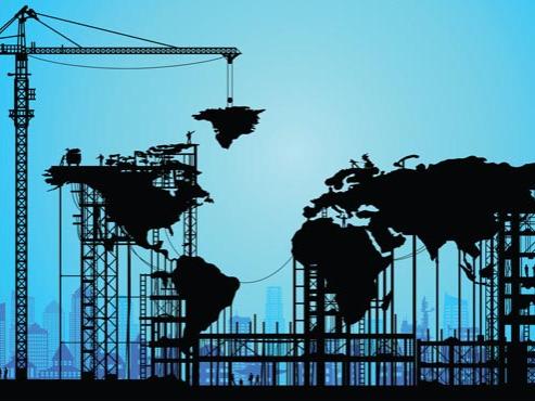 Illustration of a world map being constructed as a black silhouette on a blue background. 
