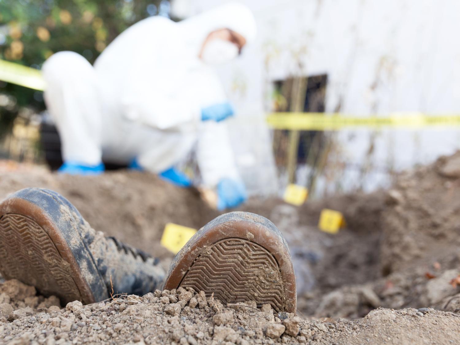 excavating victim's grave