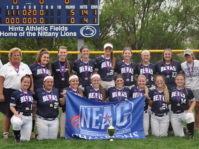 Berks Softball team with NEAC Championship flag