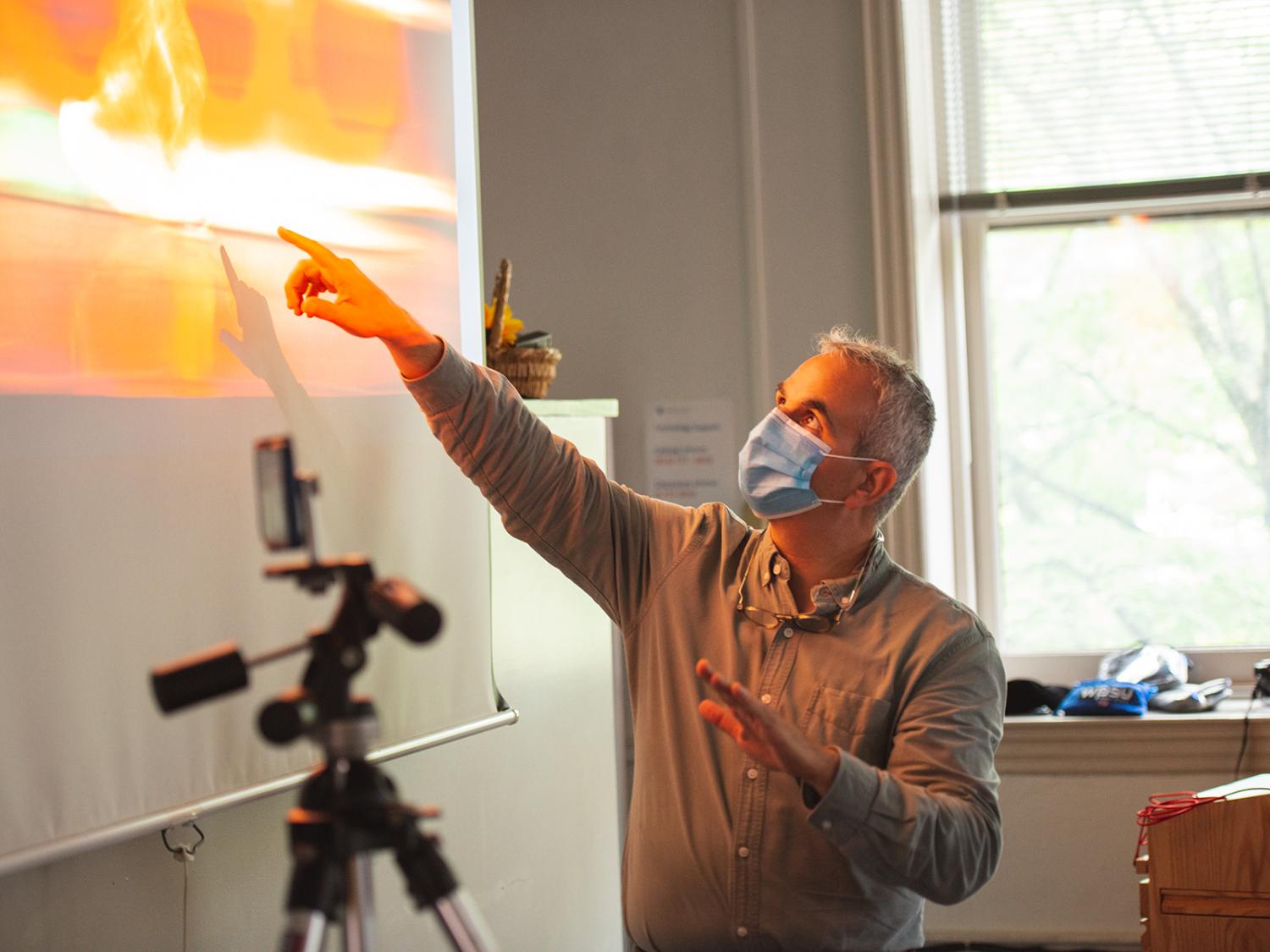Instructor teaching at the front of a classroom
