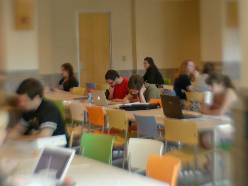 Students studying on their laptops in the HUB-Robeson Center at University Park