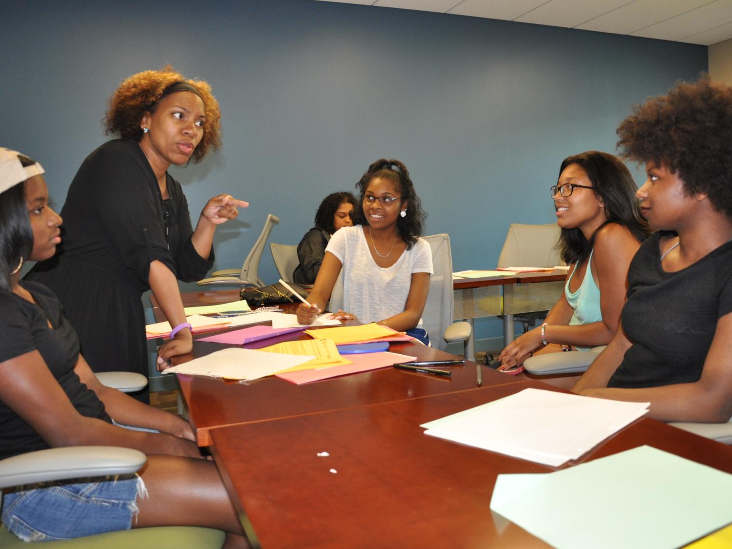 woman talking to students