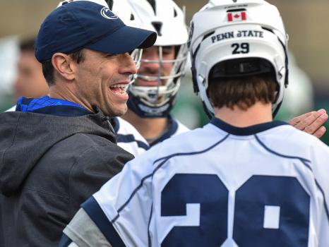 Penn State men's lacrosse coach Jeff Tambroni speaks to a player