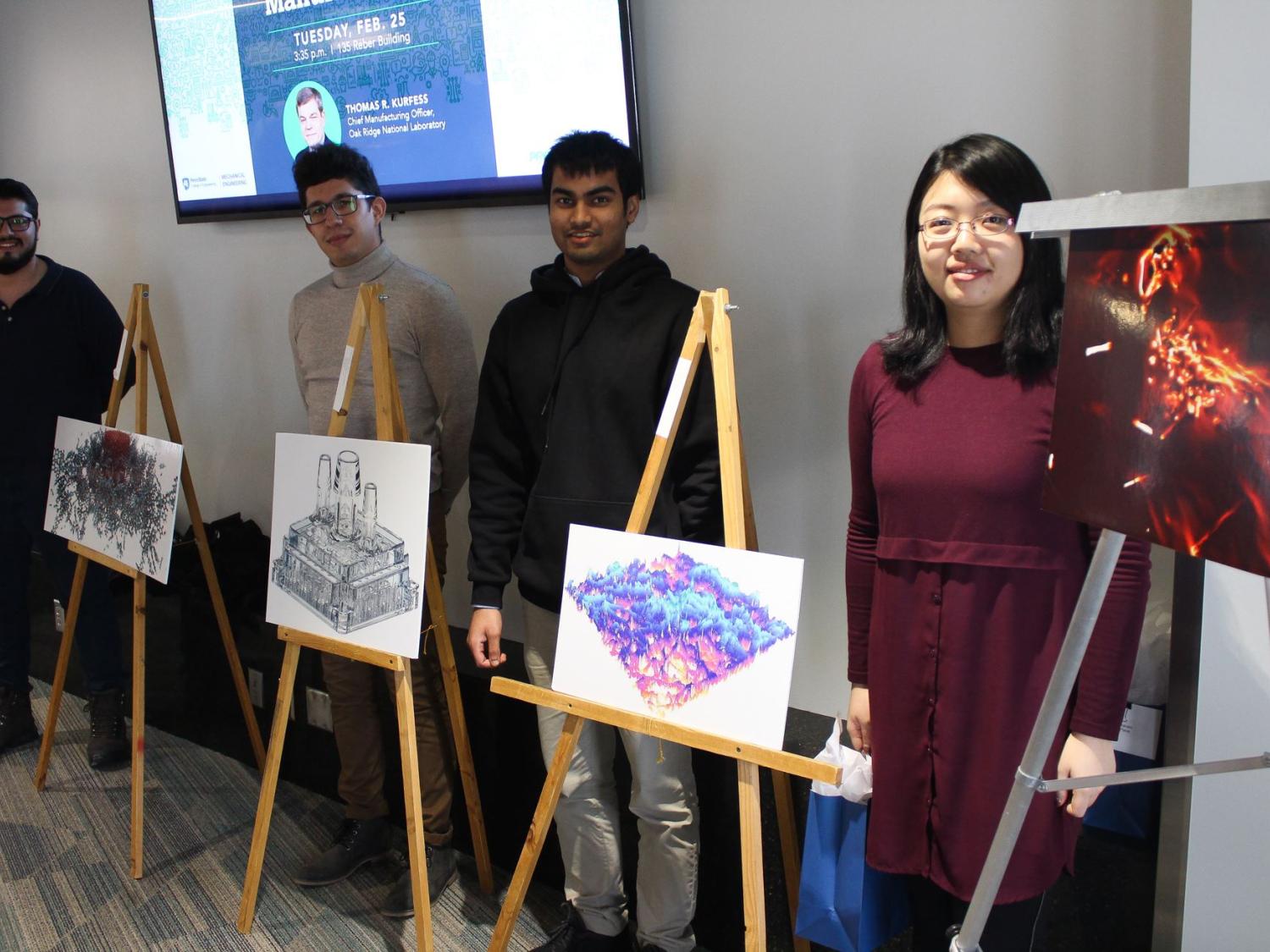 A group of graduate students pose with their winning Vizzies entries.