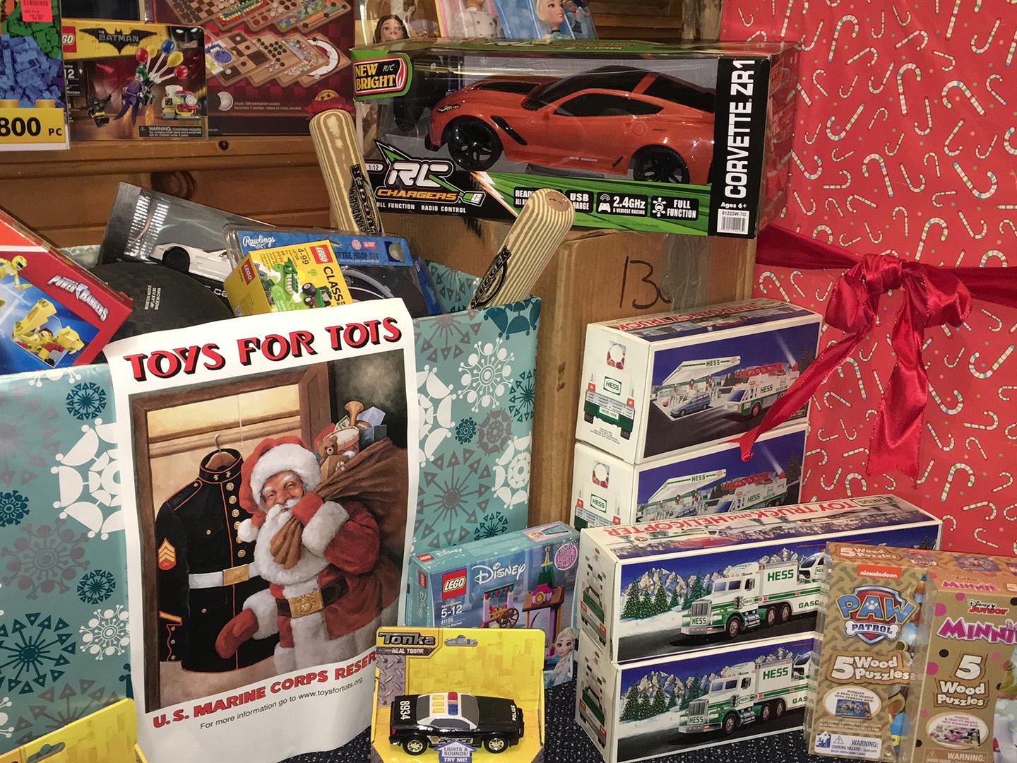 toys, cars, puzzles and games piled up