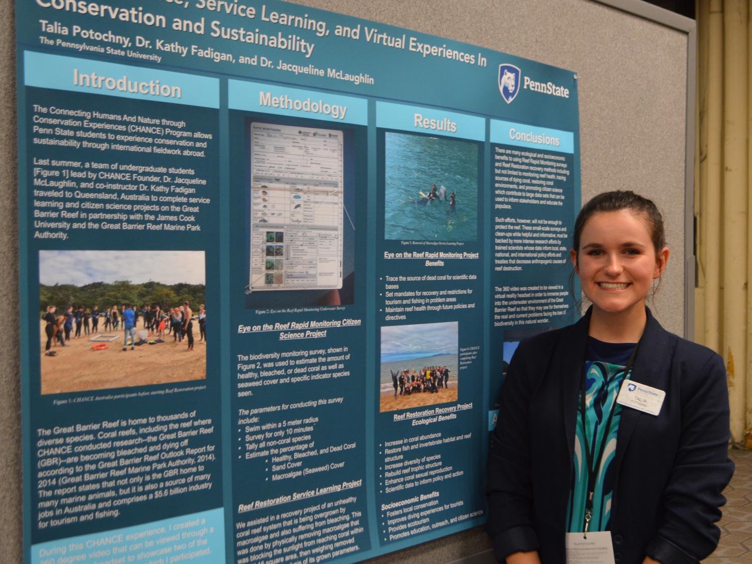 female student in front of poster