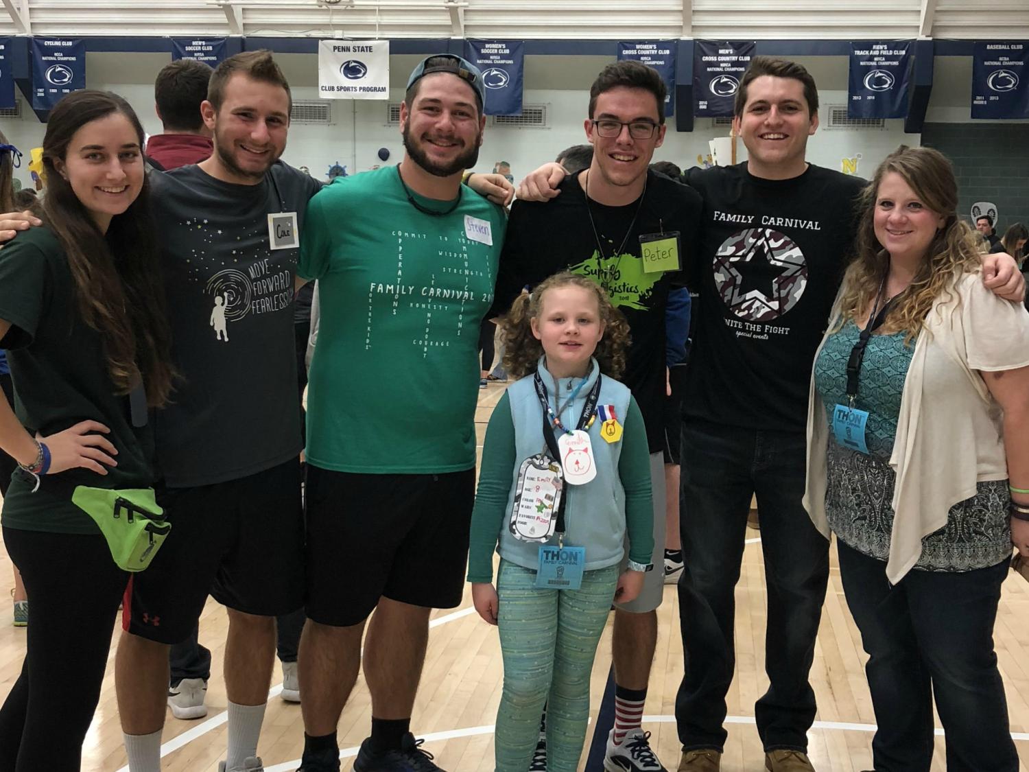 Friends and EMS THON members pose with the EMS THON Four Diamonds family at the THON Family Carnival held at the IM Building.
