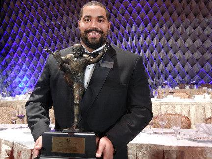 Penn State math grad student and football guard John Urschel stands with Campbell Trophy