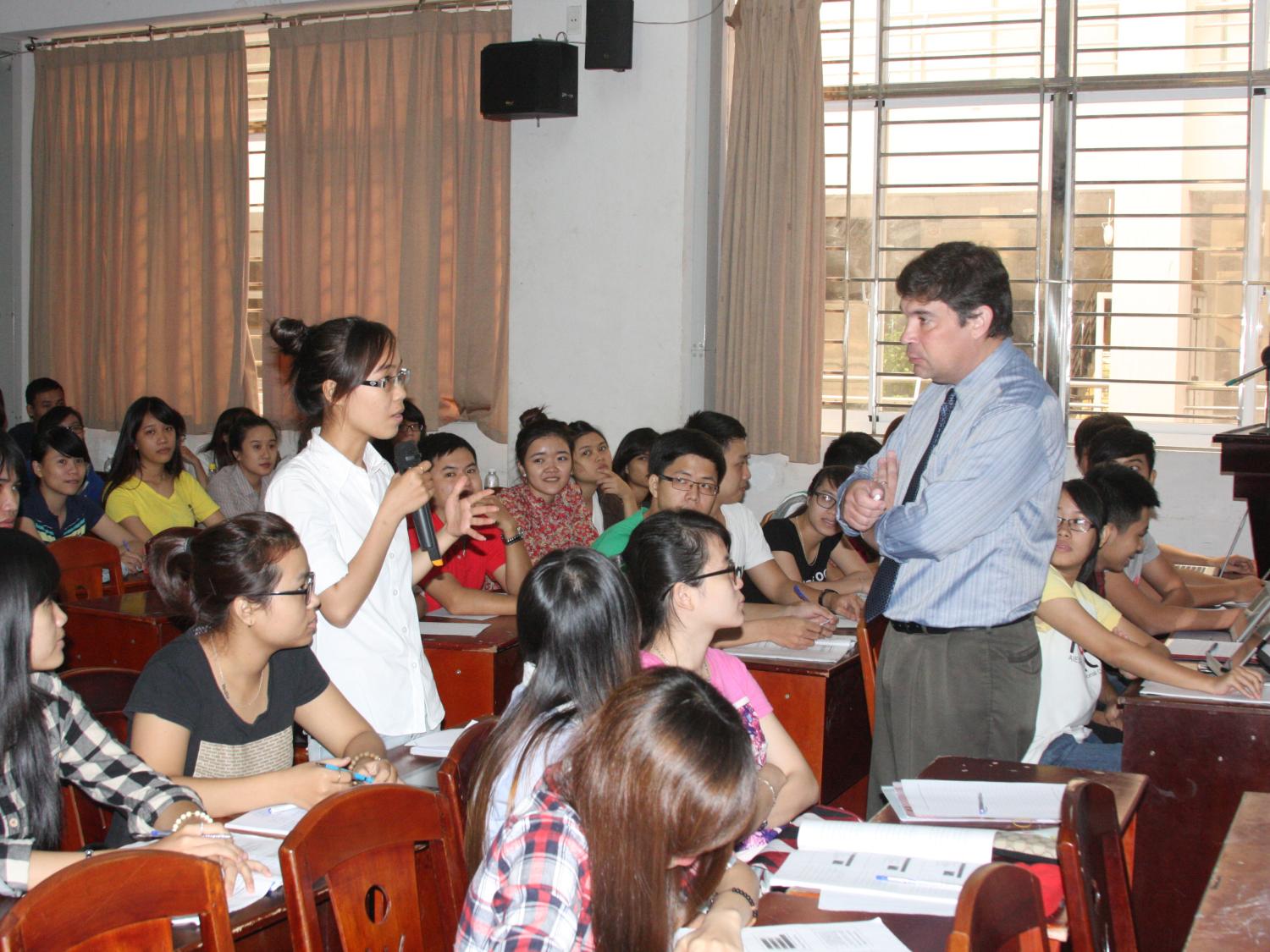 Jeff Heim with students in Vietnam