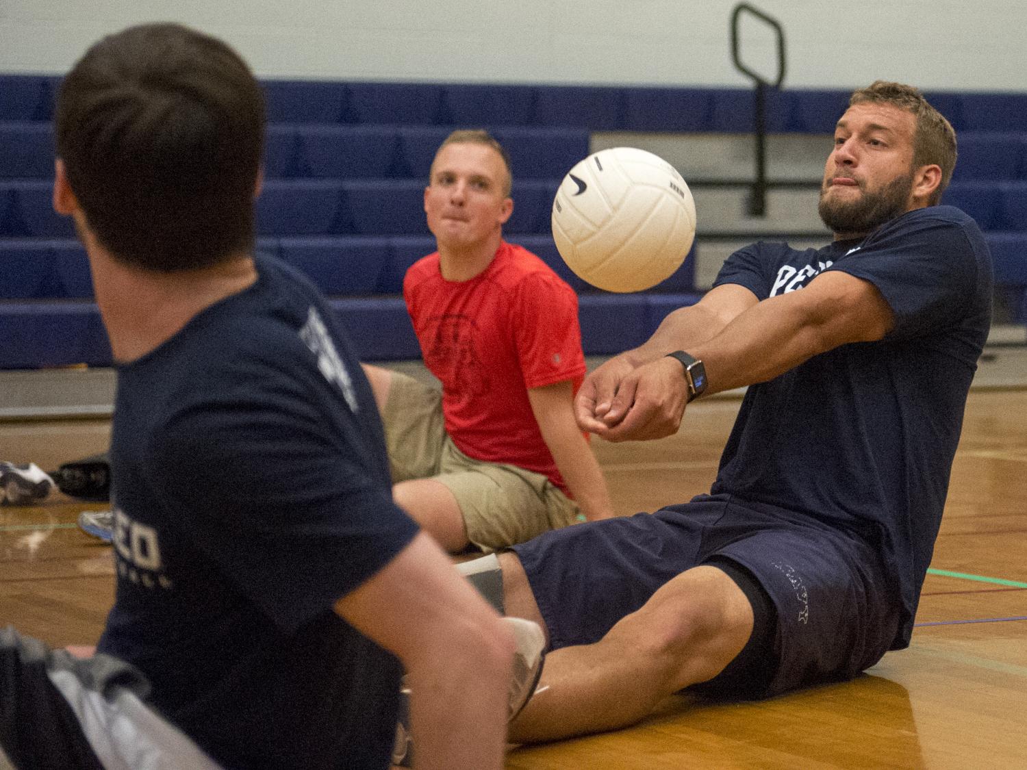 Max Rohn playing seated volleyball