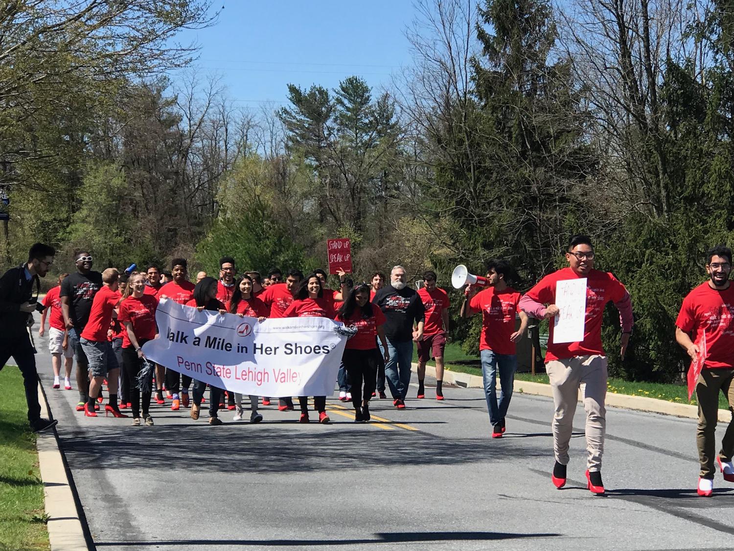 group marching in red shirts