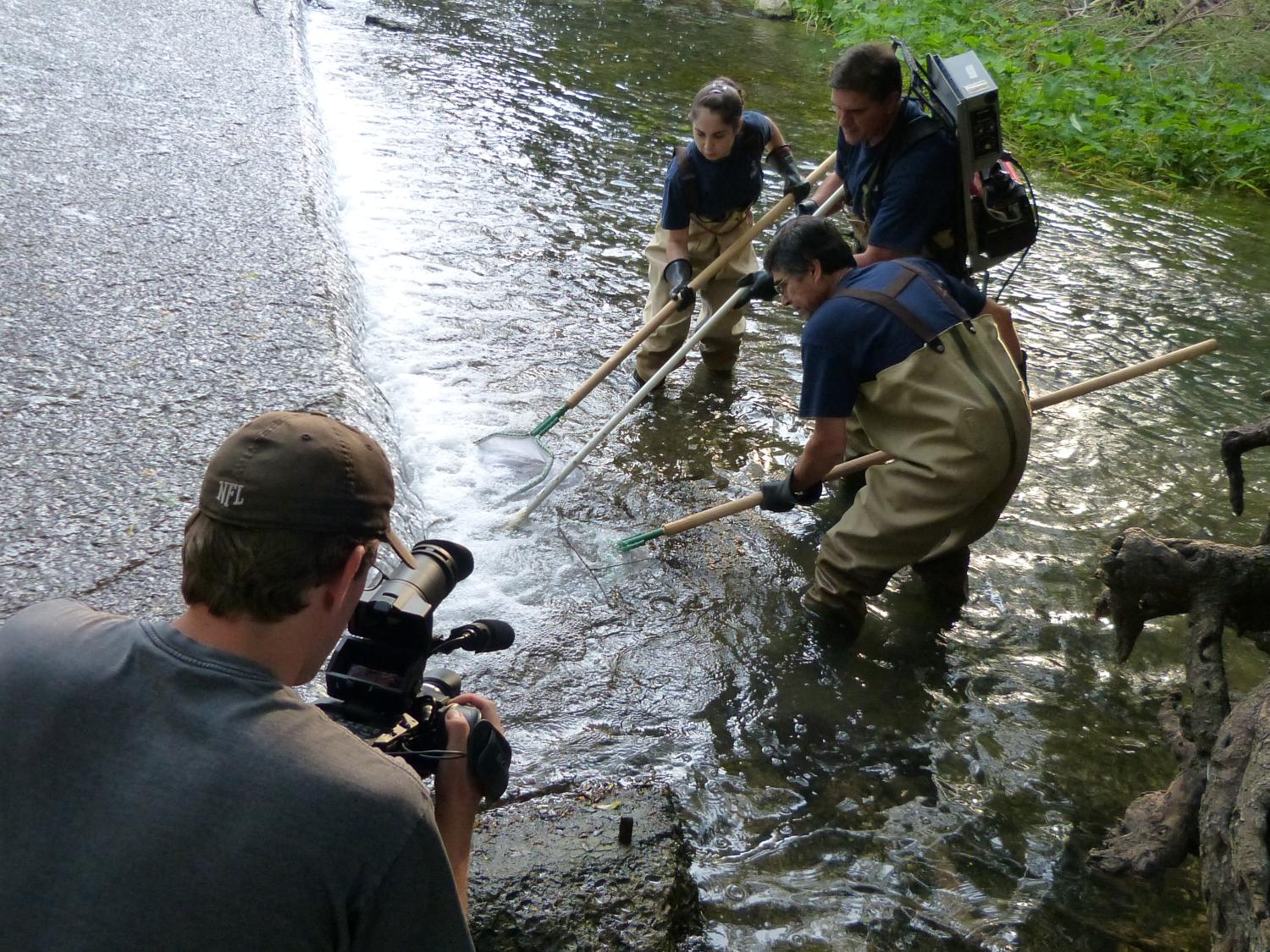 Cameraman films scientists testing water quality