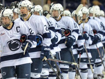 The Penn State women's hockey team lines up for a post-game handshake