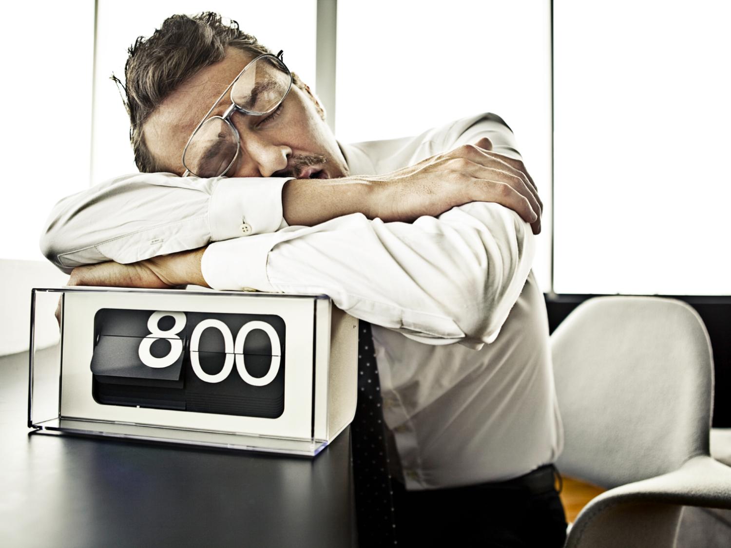 man asleep, digital clock