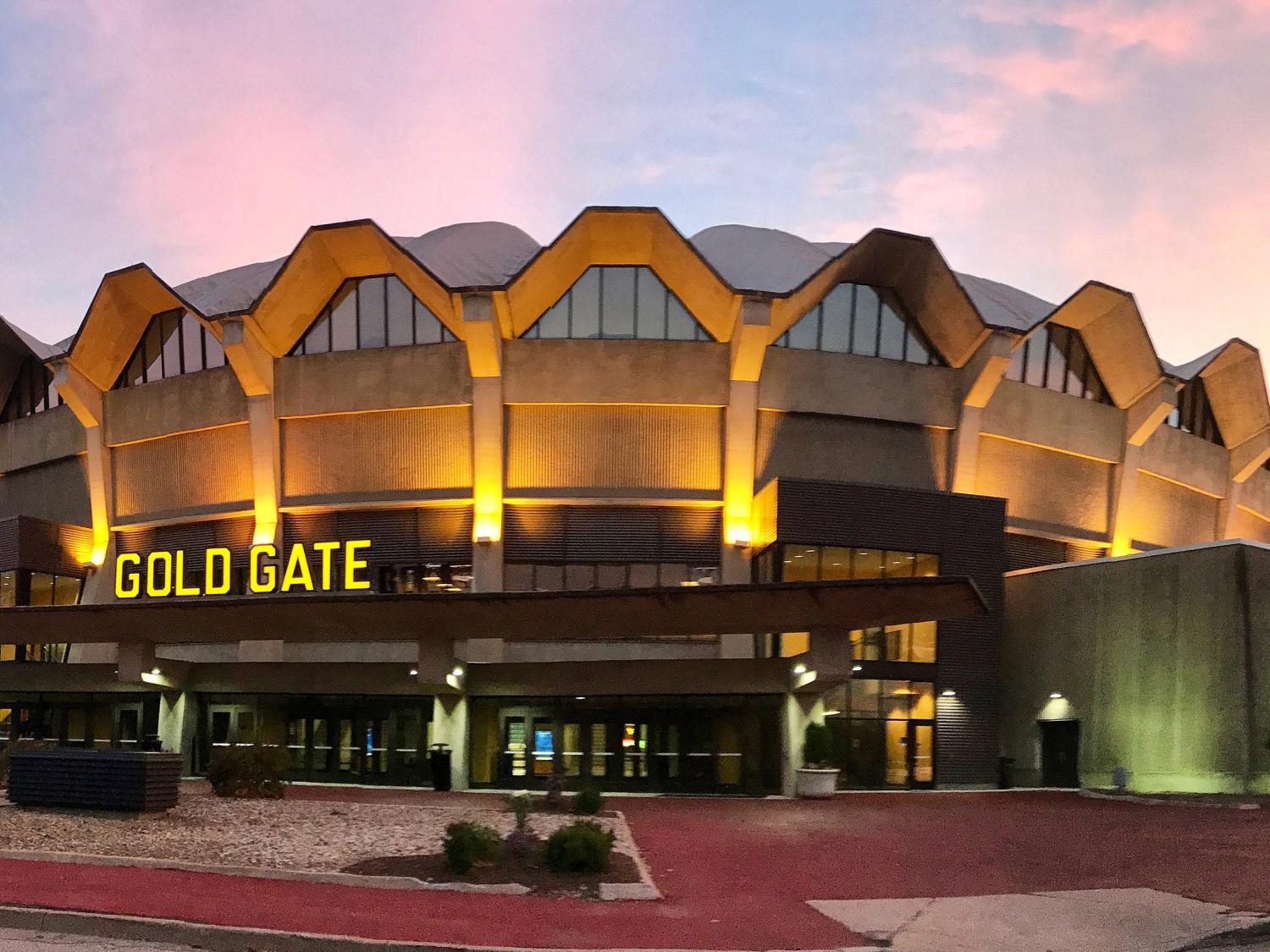 brightly lit collegiate arena at dusk