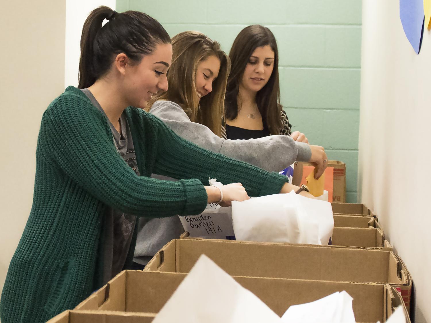 The dancer relations committee sorts mail for THON dancers.