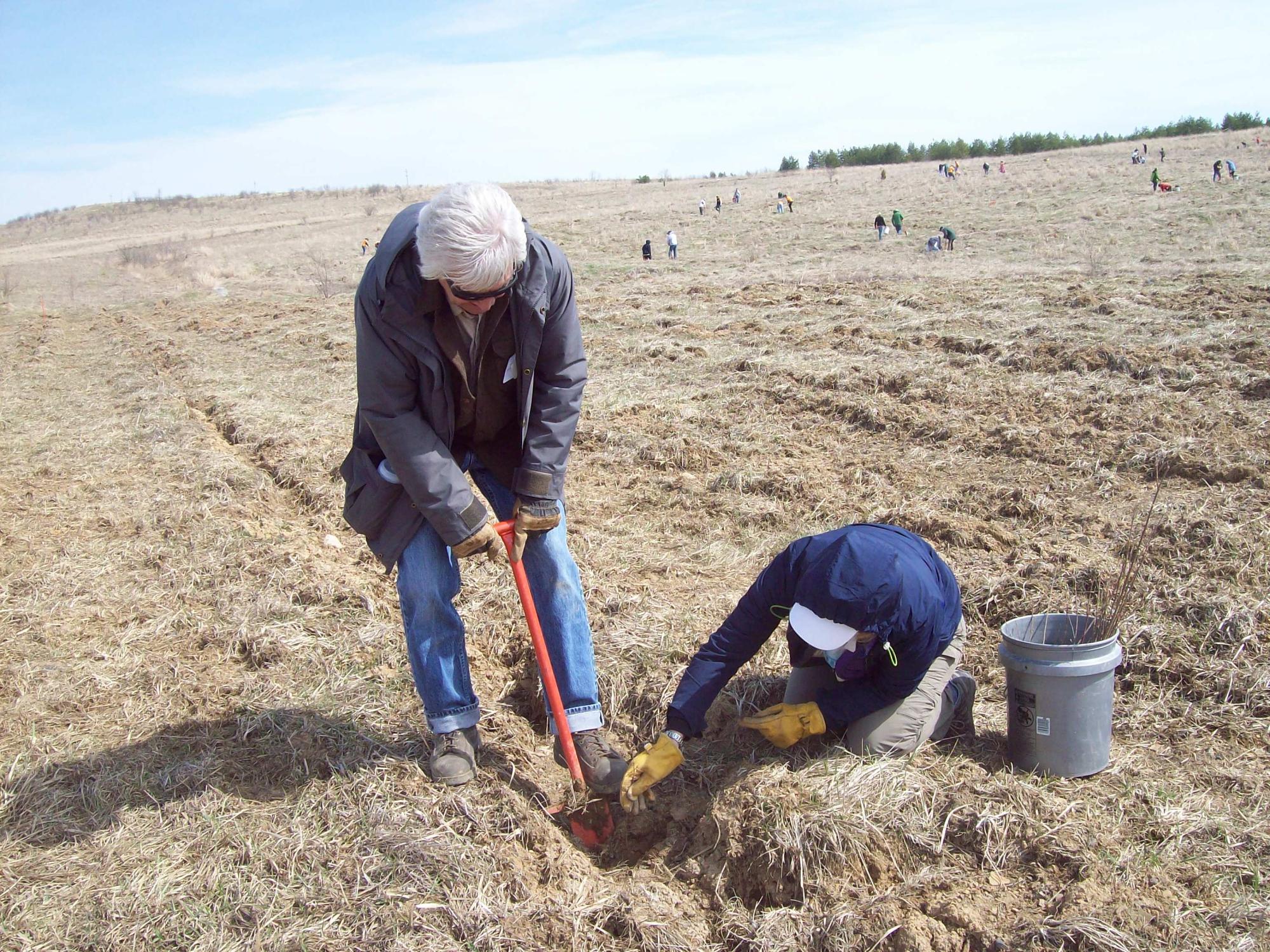 Two faculty planting at the Flight 93 Memorial