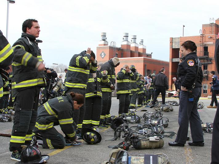 MBA students learn how to suit up in firefighter gear.